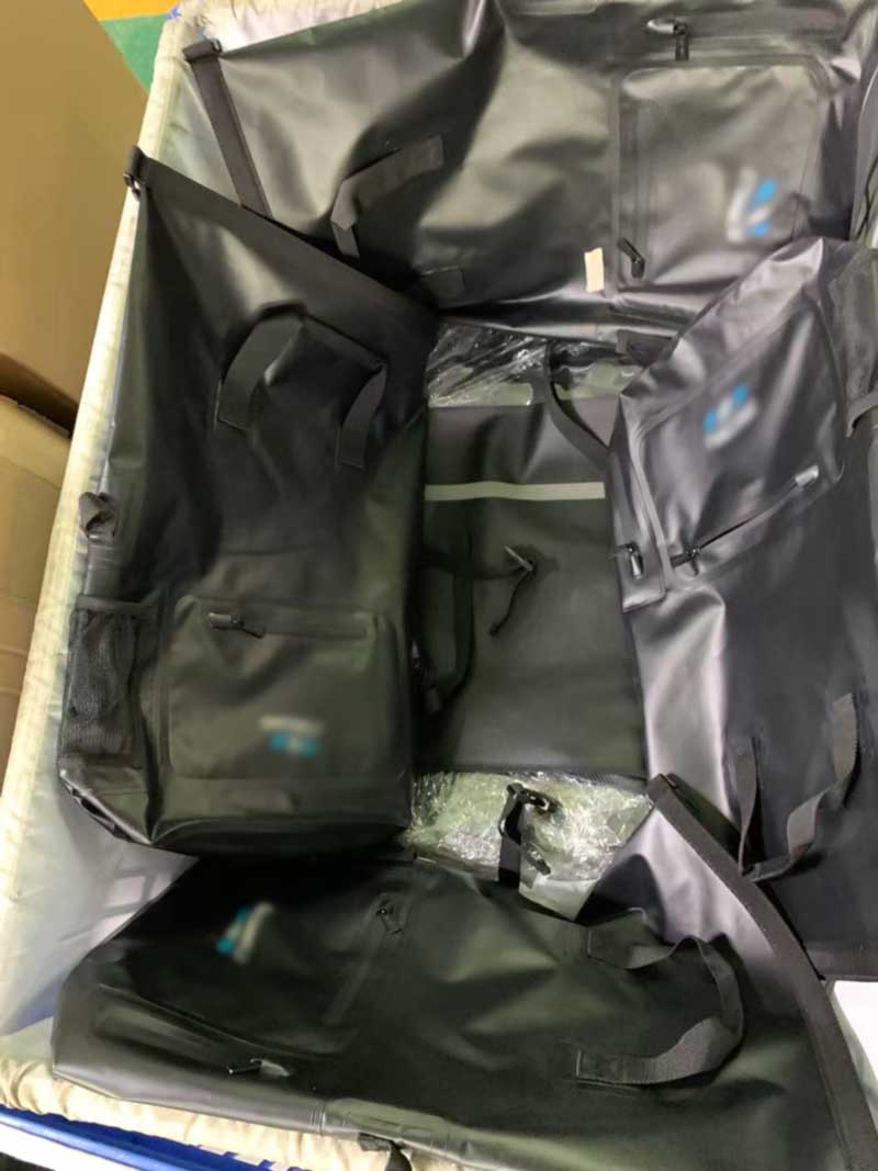 Finished welded backpacks with zippered front pocket, mesh side pocket and webbing straps